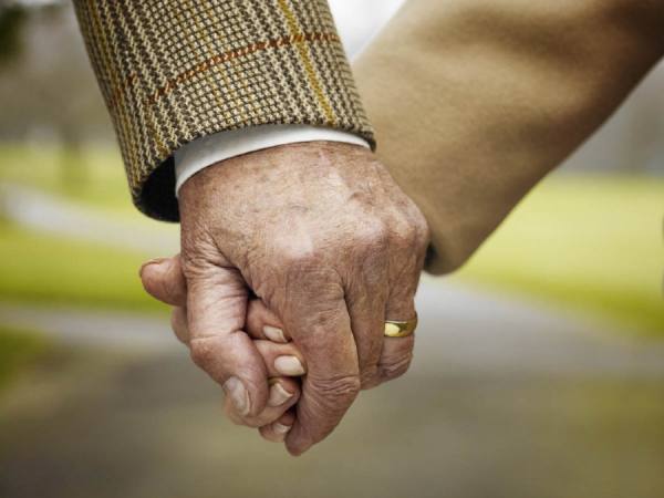 Photograph Chris Frazer Smith Holding Hands on One Eyeland